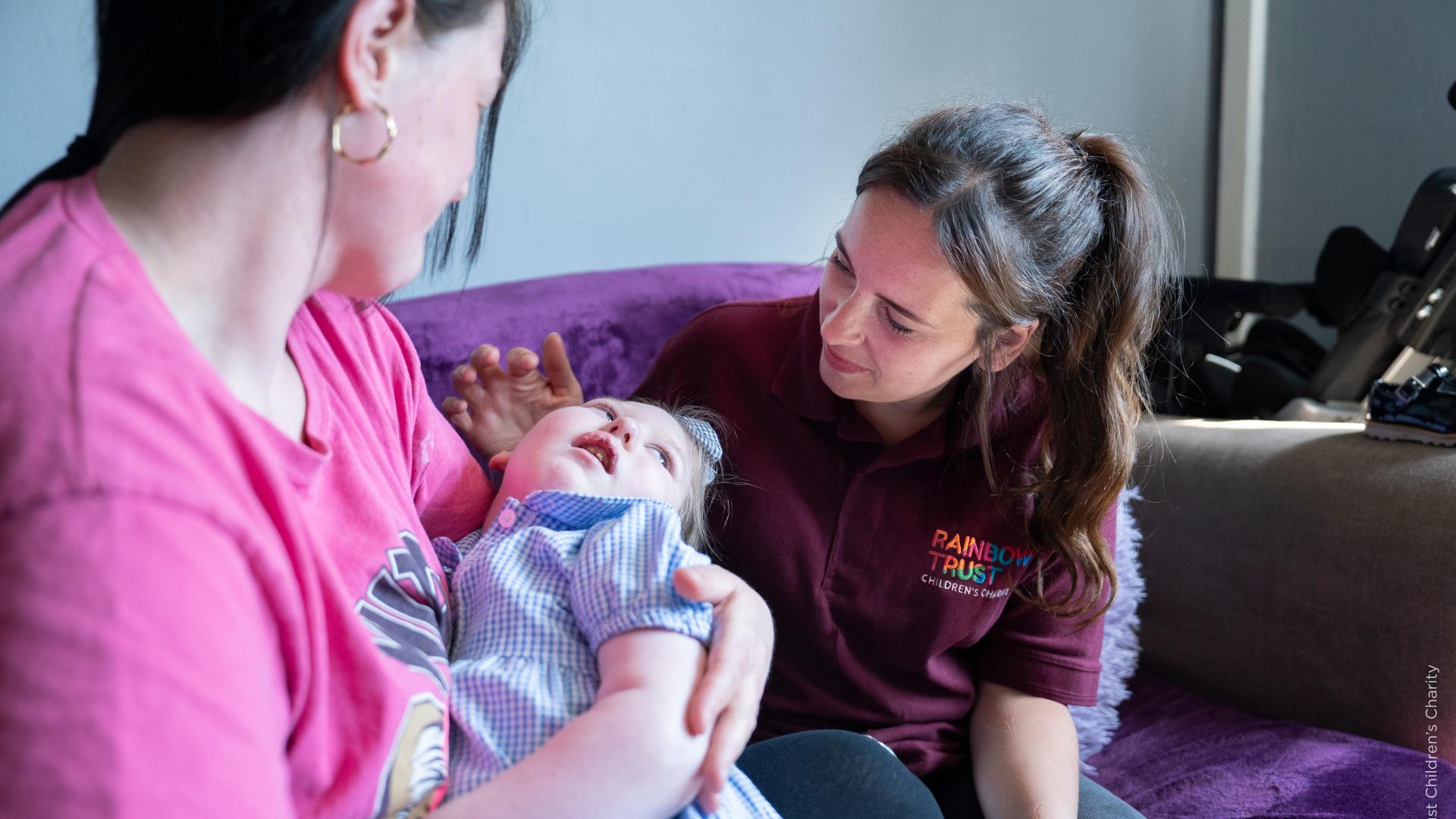 Rainbow trust support nurse with mum and child.