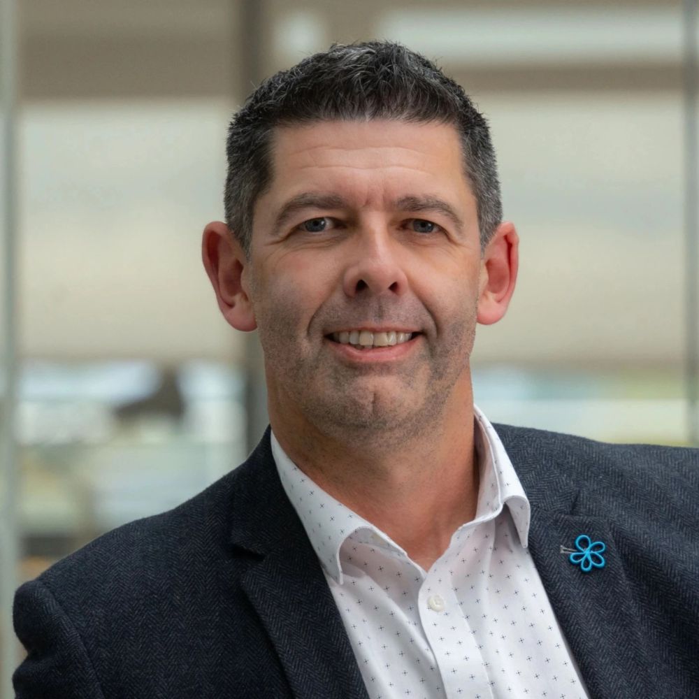 A headshot of Colin Johnson