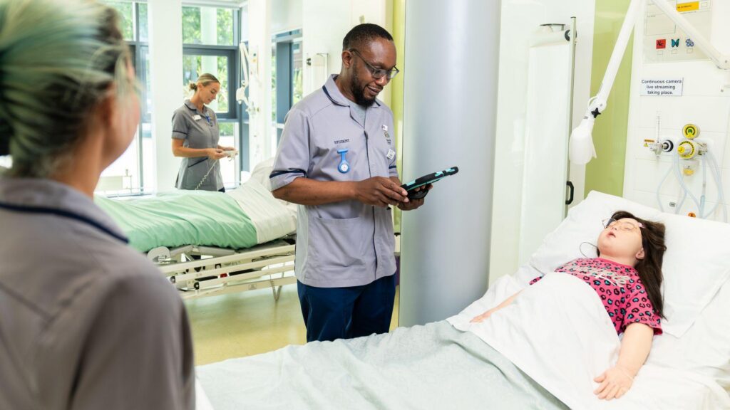 Students access a model of a patient in the clinical skills centre