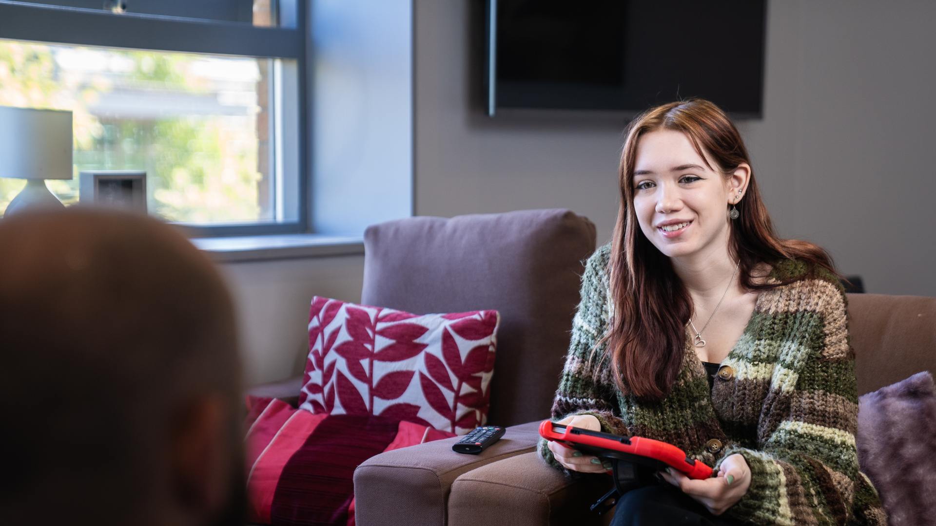 A support session takes place between two people.