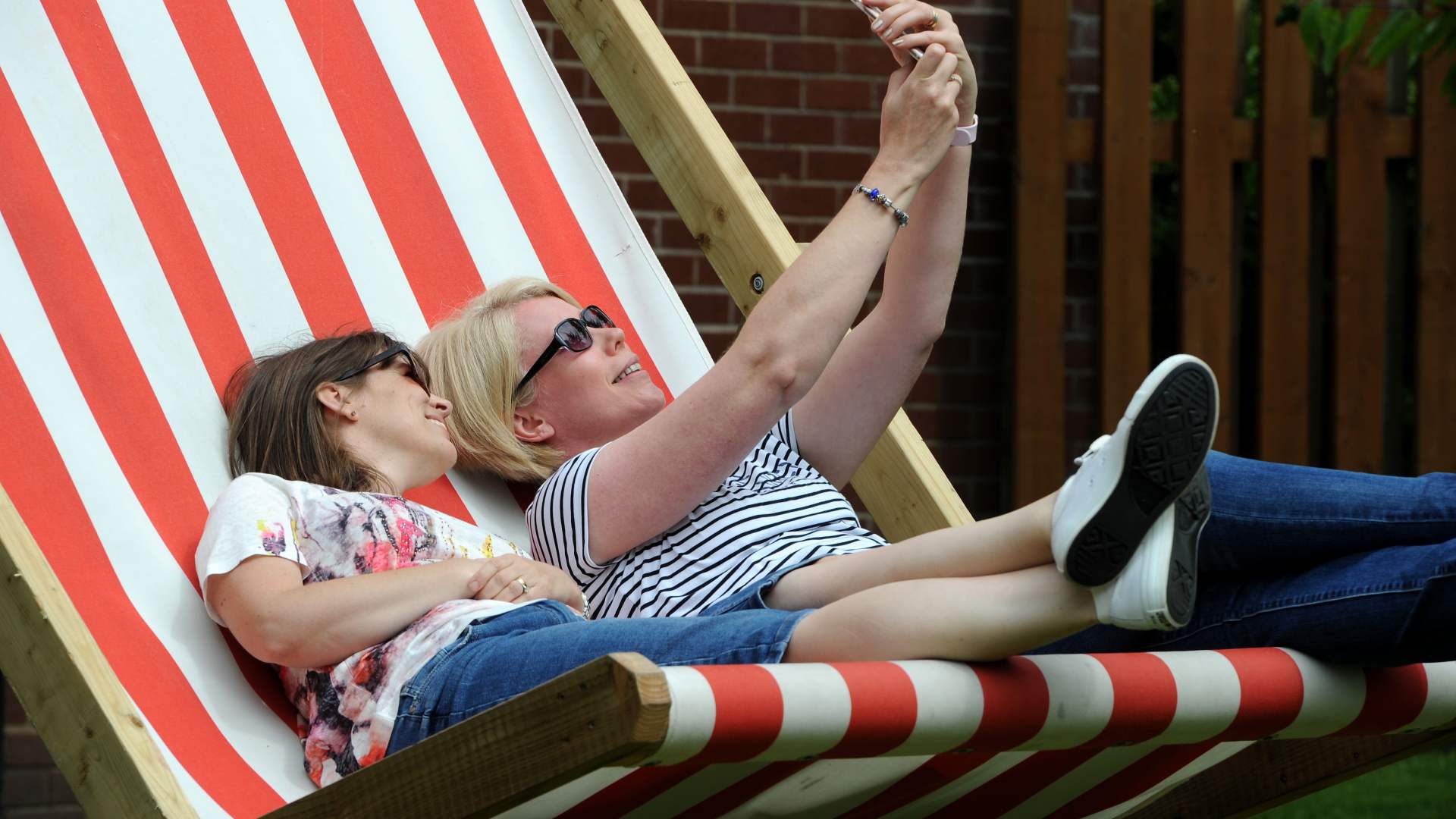 Alumni sat on a deck chair
