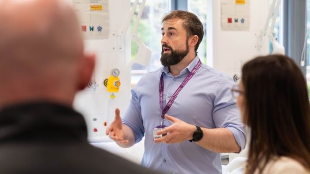Edge Hill University academic speaking in a science lab