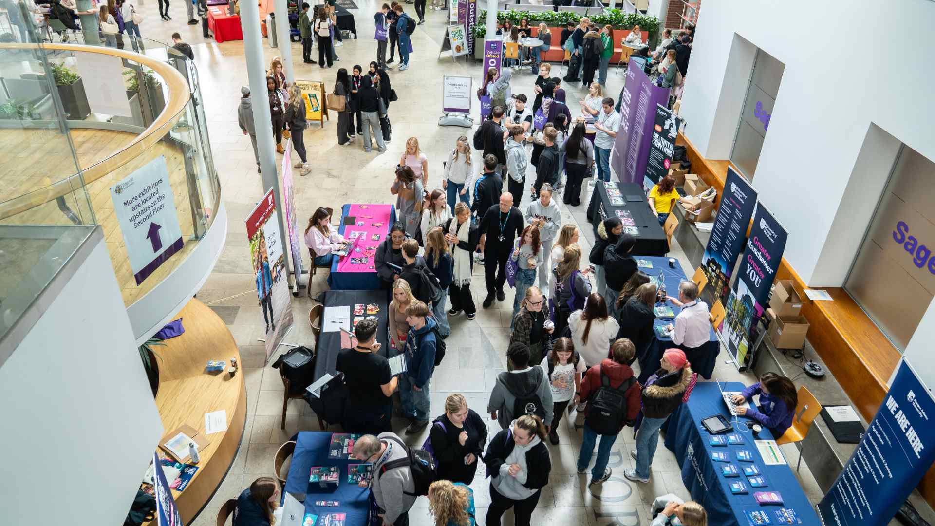 Image of visitors at an exhibition in the university Hub