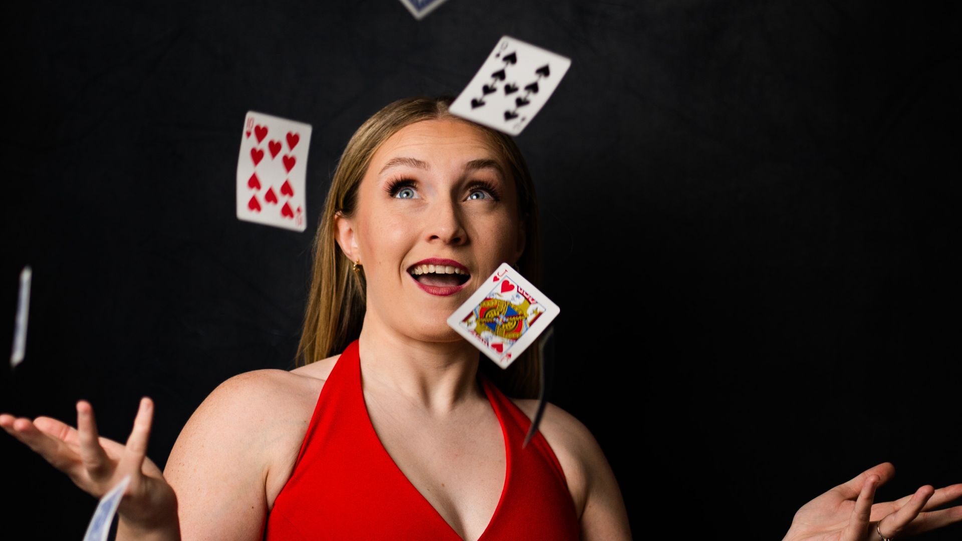 Kazia Cannon throwing playing cards in the air