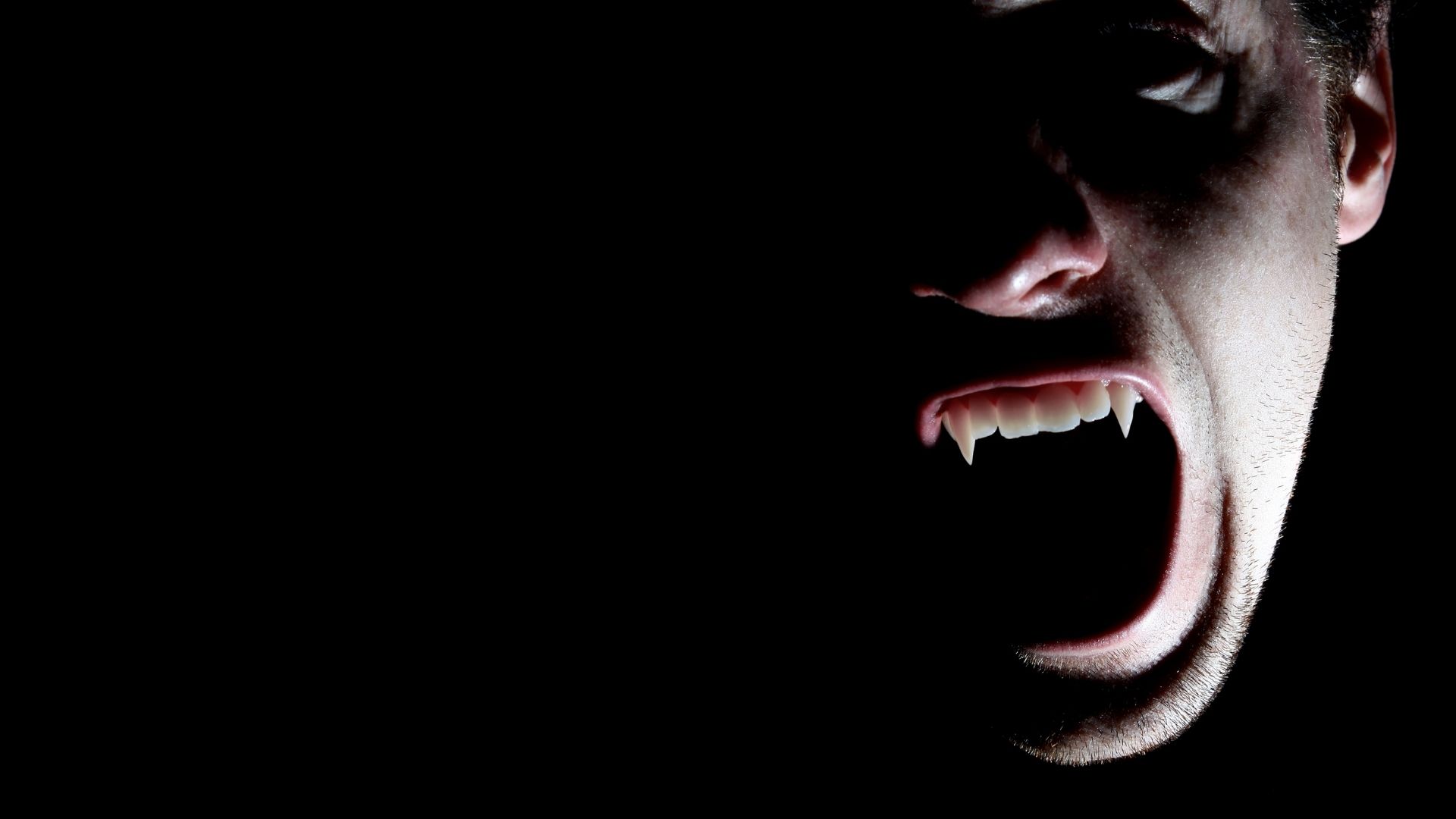 Male vampire in shadow.