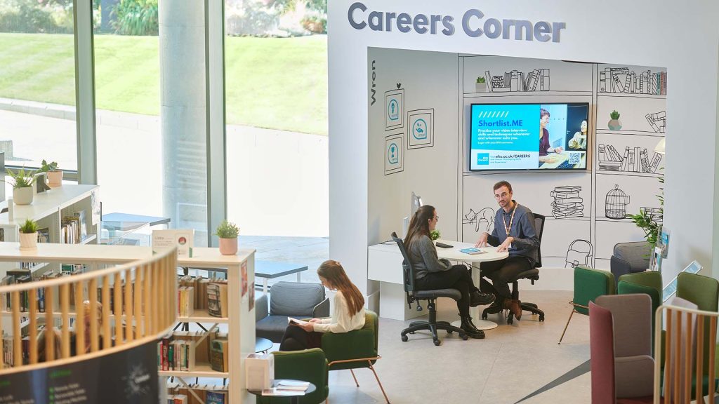 A student receiving advice from one of the Careers team in Catalyst.