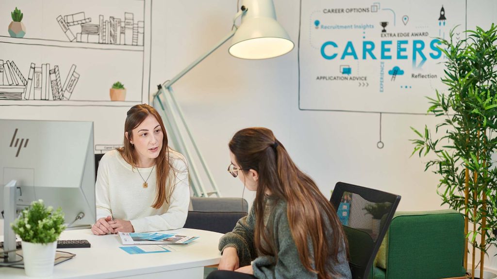A student receiving advice from one of our Careers team in the Catalyst building.