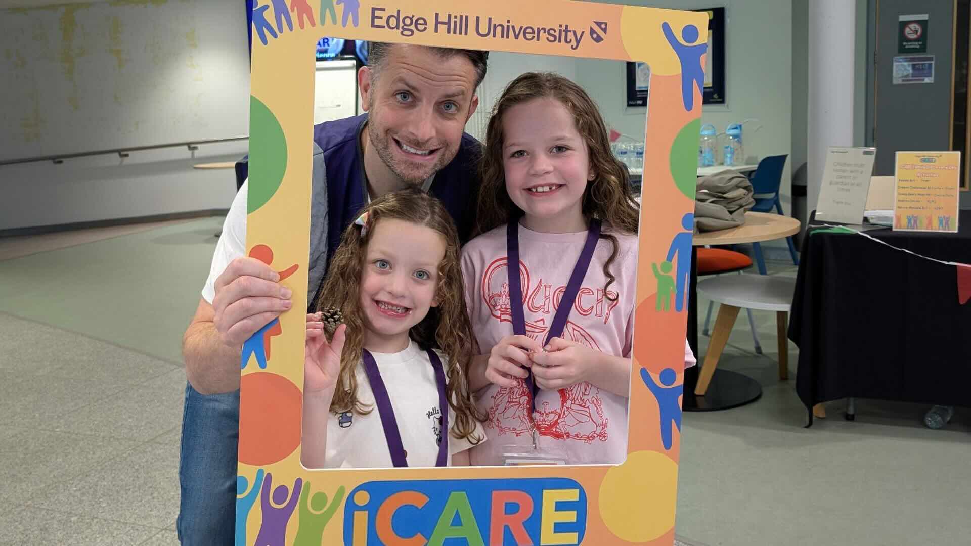 man with Icare photoframe and his two daughters smiling at the camera