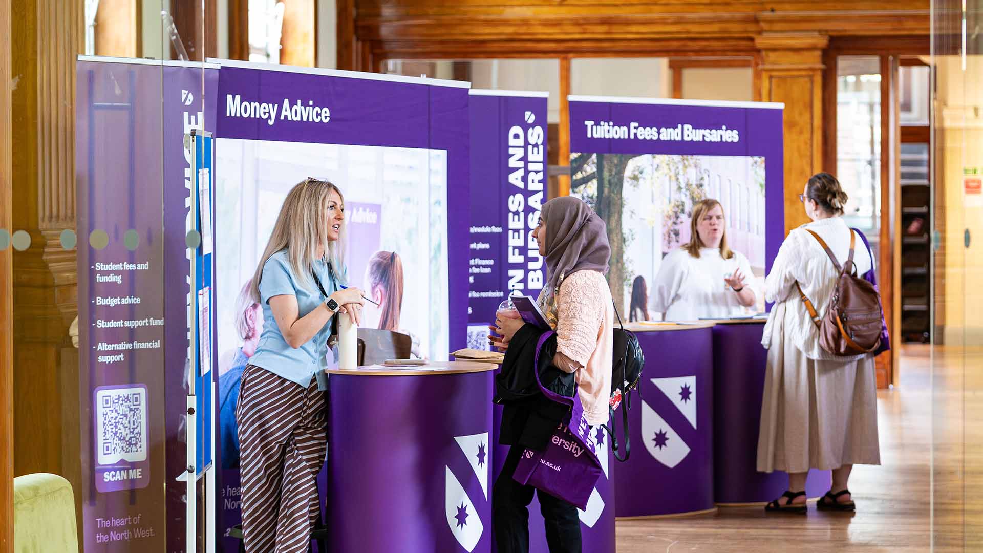 Visitors receiving advice and guidance at an Open Day